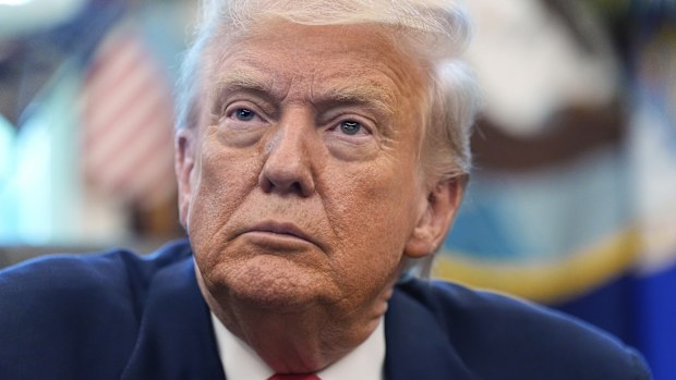 President Donald Trump listens during an event in the Oval Office to mark the 90th anniversary of the Social Security Act, Thursday, Aug. 14, 2025, in Washington. (AP Photo/Alex Brandon)