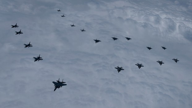 In this photo provided by South Korea Defense Ministry, U.S. and South Korea Air Force fighter jets including South Korea's F-35A stealth fighters  and U.S. F-16 fighter jets, fly in formation during a joint drill on Tuesday, June, 7, 2022.  