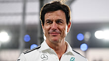 Mercedes team principal Toto Wolff looks on.