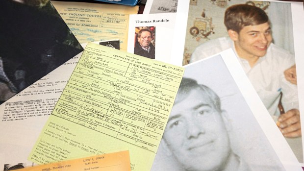 Photos, a driver's license, a death notice and other items from a 1969 robbery involving Ted Conrad are shown at a US Courthouse in Cleveland. 