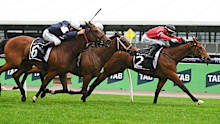 Jordan Childs riding Just Fine (right) to win The Lexus Bart Cummings at Flemington.