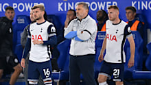 Tottenham Hotspur manager Ange Postecoglou looks on as substitutes prepare to take the field. 