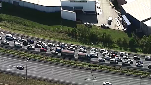 Traffic chaos after ute flips on Brisbane's Gateway Motorway | Nine.com.au