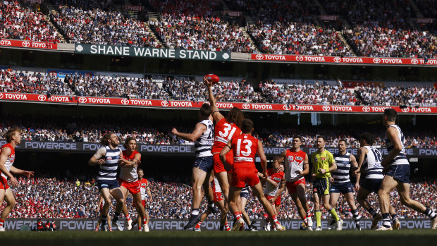 Tom Hawkins of the Cats and Tom Hickey of the Swans contest the ruck during the 2022 AFL Grand Final match between the Geelong Cats and the Sydney Swans at the Melbourne Cricket Ground on September 24, 2022 in Melbourne, Australia. (Photo by Daniel Pockett/AFL Photos/via Getty Images)