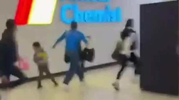Police admitted it was a "frightening" situation for shoppers.Some were seen carrying young children and running with prams.
