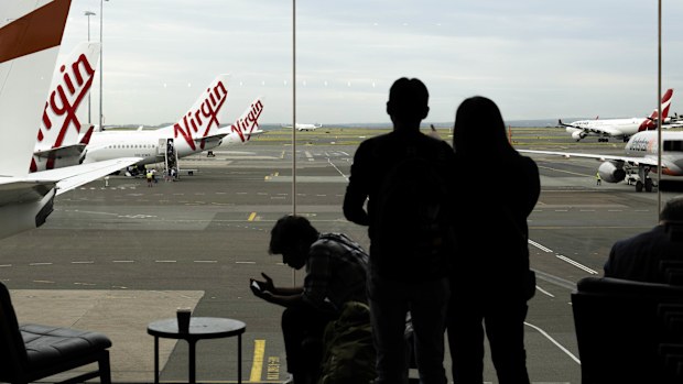 Passengers wait to catch their flights at Sydney's domestic airport