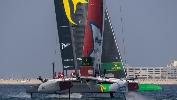 Canada, helmed by Phil Robertson, crosses paths with Australia, helmed by Tom Slingsby, during a practice session ahead of the Dubai SailGP race weekend.
