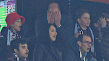 William, Prince of Wales, reacts after a missed chance with son George.