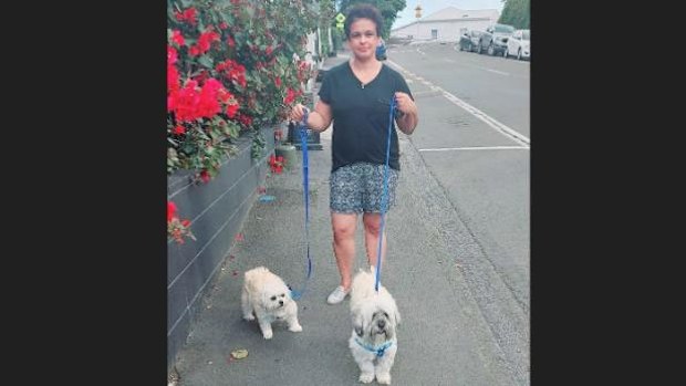 Nuzia Scaranci with her dogs Ruby, left, and Simba, right.