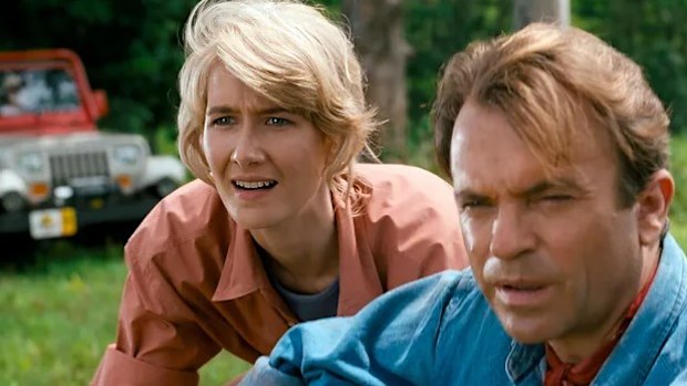 Laura Dern and Sam Neill on the set of Jurassic Park in 1993.