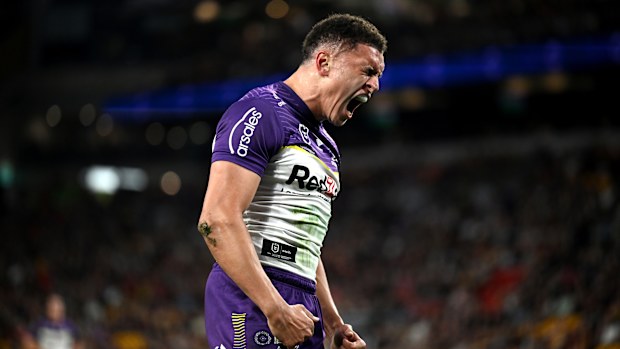 Will Warbrick celebrating after scoring a try for the Storm against the Broncos in round 27.
