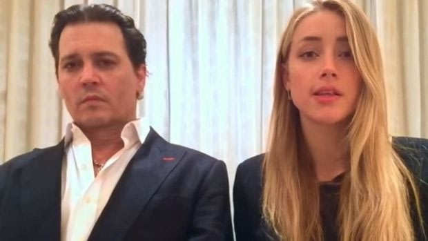 Johnny Depp and Amber Heard in their now infamous dog-smuggling apology video.