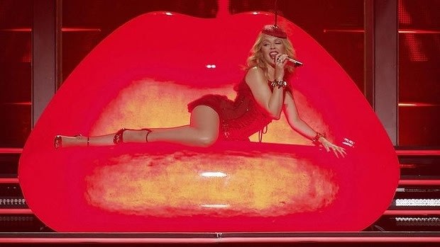 Kylie Minogue began her Perth concert in a red glittering corset. 


