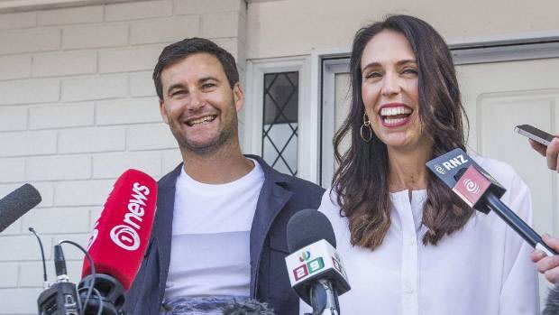 New Zealand Prime Minister Jacinda Ardern, right, with her partner Clarke Gayford outside their home on Friday.