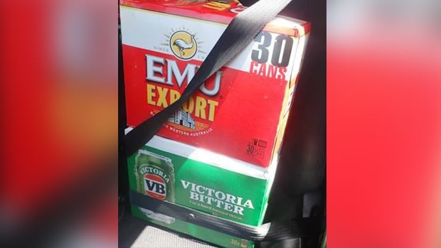 Cartons of beer were buckled into position while unrestrained children were in the car.