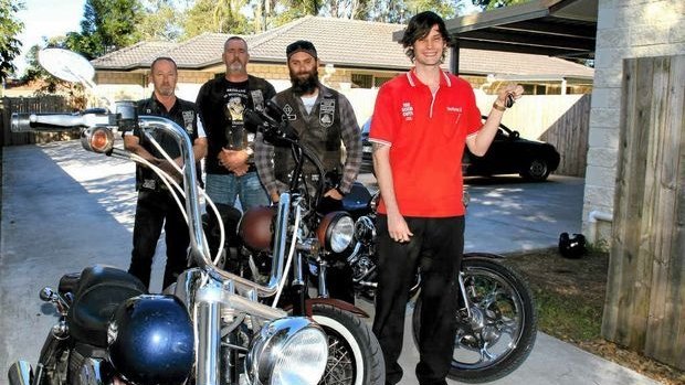 Dave Fleming, Emmett O'Brien (president) and Tim Phelps (treasurer) of the Brisbane chapter of the American Motorcycle Club and The Good Guys Morayfield team leader Alex Gillespie with the keys to the new houses fundraising from BAMC and The Good Guys helped supply.