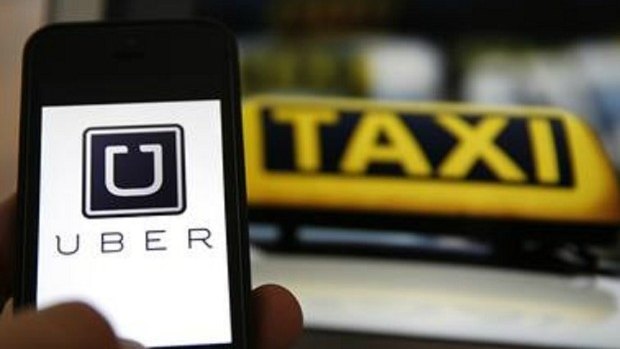 Uber Technologies has asked its Russian drivers to temporarily bear the load of a new tax charge.