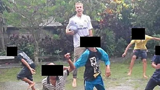 Oliver Bridgeman's Facebook page shows him playing football with children in Bali.