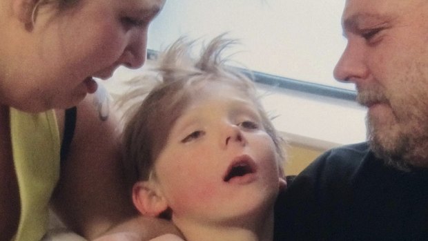 British boy Mason Timmins, 7, died from meningitis minutes after this photos was taken in December 2013. This image was released by his mother Claire Timmins to try to raise awareness of the infection. 