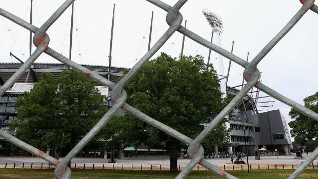 Ring of steel: The fence surrounding the MCG last summer.