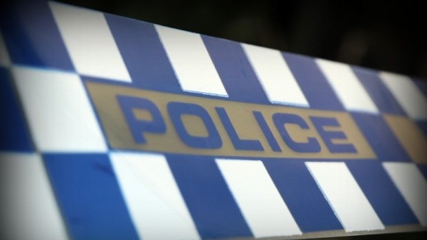 A man has barricaded himself in a shed with a firearm.