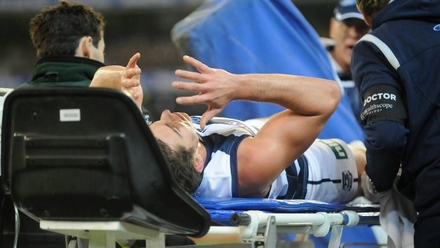 Daniel Menzel suffers another injury in Geelong's qualifying final against Hawthorn in 2011.