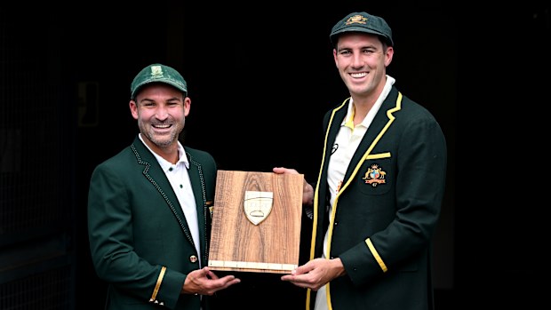 Captains Pat Cummins of Australia and Dean Elgar of South Africa poses for a photo during an Australian Test squad training session at The Gabba on December 16, 2022 in Brisbane, Australia. (Photo by Bradley Kanaris/Getty Images)