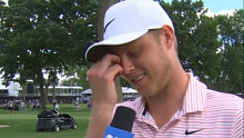 Cameron Davis gets emotional in an interview after winning the Rocket Mortgage Classic.