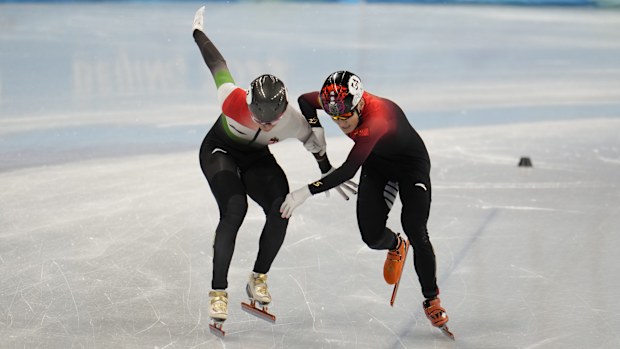 Shaolin Sandor Liu and Ziwei Ren compete during the men's 1000m final.