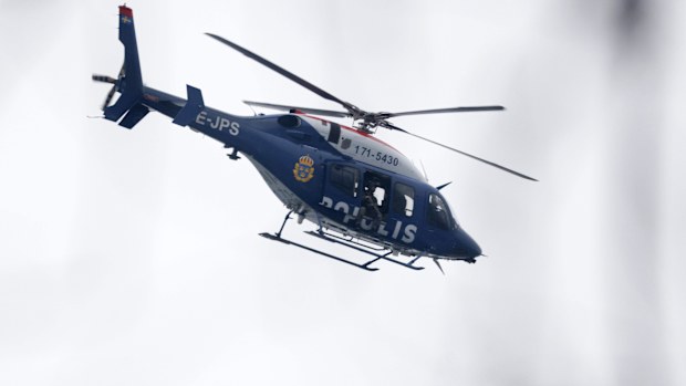A helicopter at the scene of an incident at Risbergska School, in Örebro, Sweden