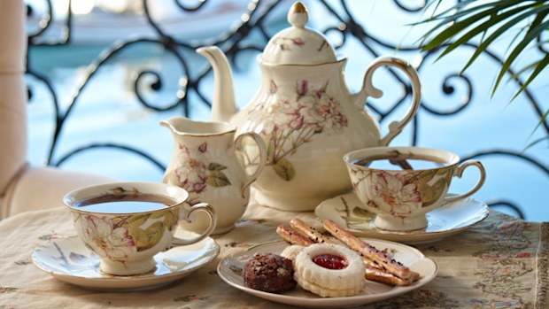 Teapot, cups and biscuits (Getty)