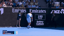 Stan Wawrinka picks up a fan's beer.