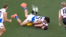 Josh Sinn of the Power is tackled by Paul Curtis of the Kangaroos during their round-seven match.
