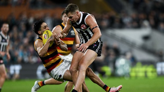 Izak Rankine is knocked down after being bumped by Dan Houston.