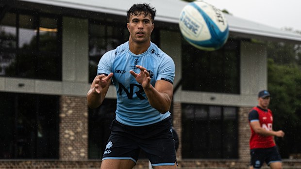 Joseph-Aukuso Suaalii catches a ball at Waratahs training.
