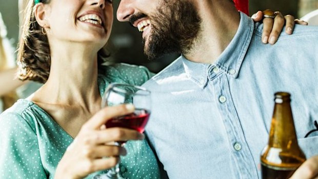 Woman drinking wine with friend