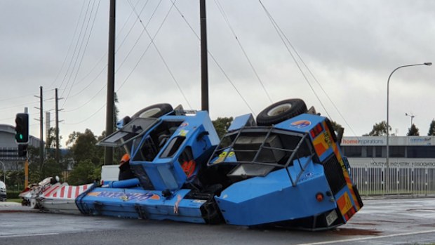 A crane has collapsed across a road in Newcastle, NSW
