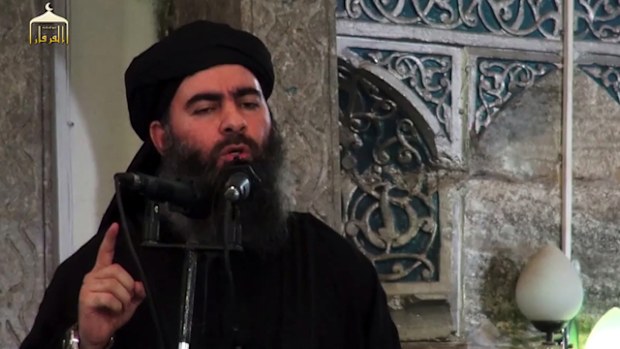 Abu Bakr al-Baghdadi, aka Caliph Ibrahim, adressing Muslim worshippers at a mosque in the militant-held northern Iraqi city of Mosul. 