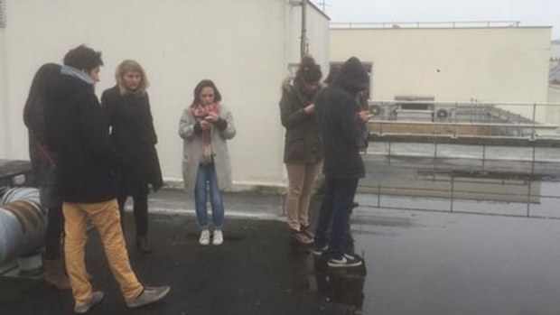Martin Boudot tweeted this image of his colleagues on the roof during the shooting at Charlie Hebdo.