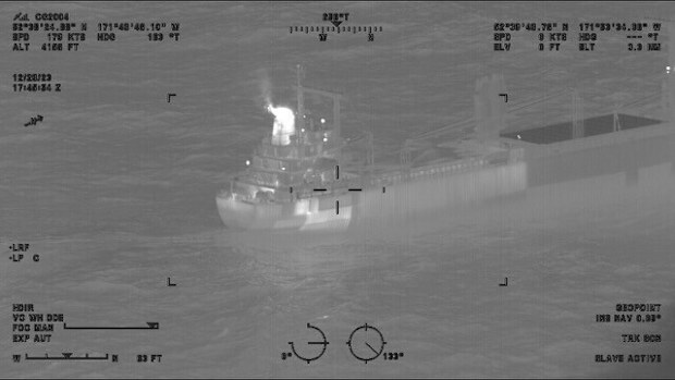This image provided by the U.S. Coast Guard shows a reported fire aboard the cargo vessel Genius Star XI, southwest of Dutch Harbor, Alaska on Thursday, Dec. 29, 2023. The large cargo ship with a fire in its hold is being kept 2 miles (3.22 kilometers) offshore of an Alaska port as a precaution while efforts are undertaken to extinguish the flames, the U.S. Coast Guard said Saturday.  (Lt.Cmdr. Michael Salerno/U.S. Coast Guard via AP)