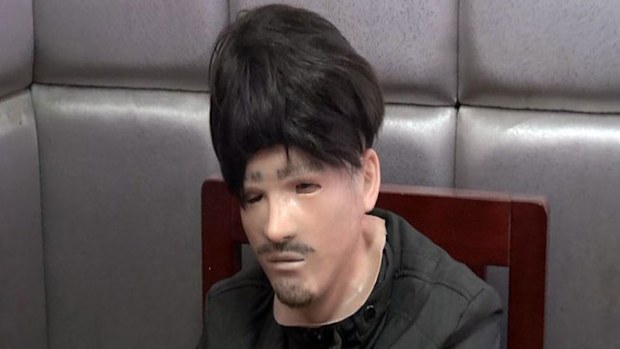Cheng wearing the mask he hoped would scare his ex-wife (Supplied). 