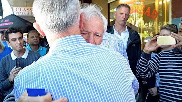 Australian Prime Minister Malcolm Turnbull hugs Serge Oreshkin, who lost his son Victor in the downing of MH17 during a street walk in the electorate of Reid in Sydney. (AAP)