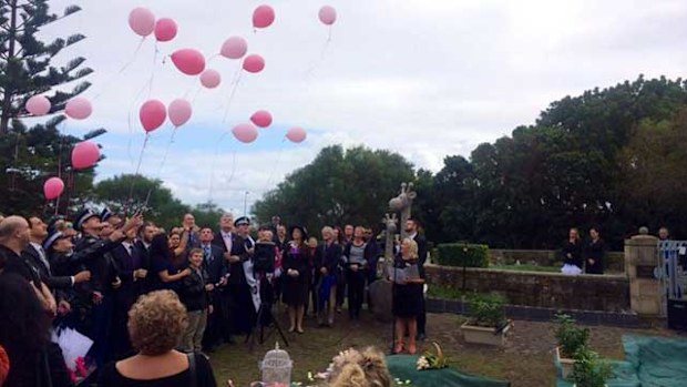 Mourners released pink balloons to farewell dumped newborn Lily Grace. (Source: Twitter/Southern Courier)