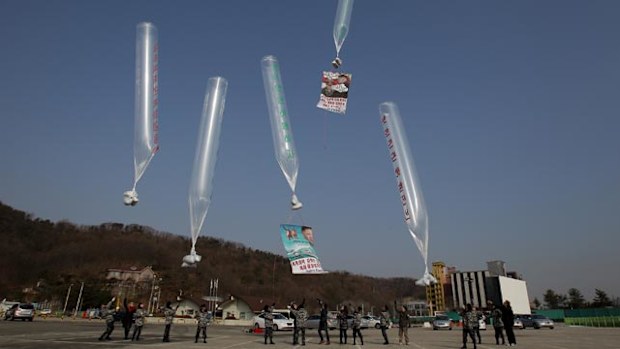 The balloons contain cigarette butts and human waste. (Getty)