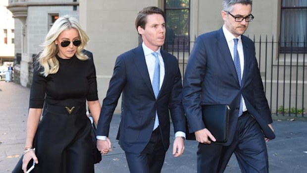 Stockbroker Oliver Curtis (centre) arrives with his wife Roxy Jacenko (left) at the Supreme Court in Sydney yesterday. (AAP)