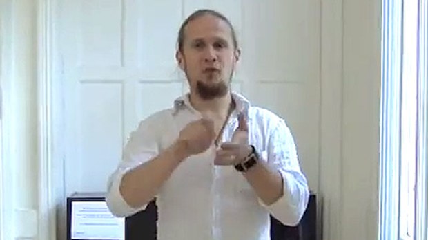 Vitalis Katakinas signs in an online video.