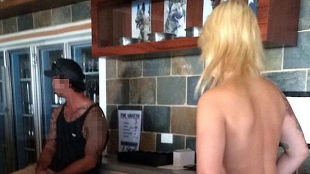 A topless barmaid at a government recreation club.