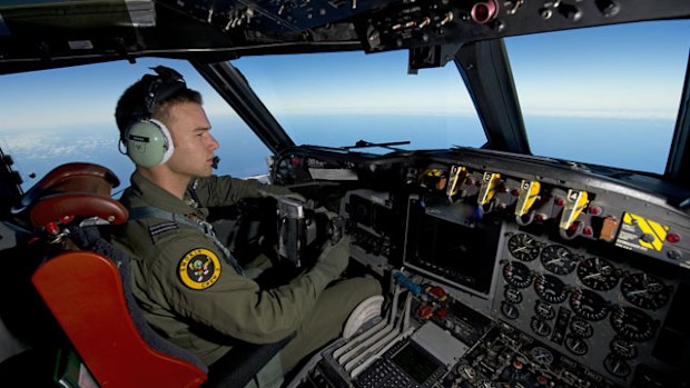 Royal Australian Air Force pilot, Flight Lieutenant Russell Adams from 10 Squadron, steers his AP-3C Orion over the Southern Indian Ocean. (AAP)