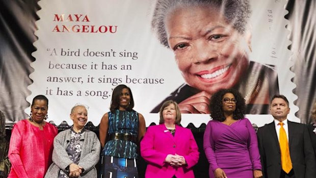Michelle Obama and Oprah Winfrey at the launch of the stamp in Washington on Tuesday. (AAP)