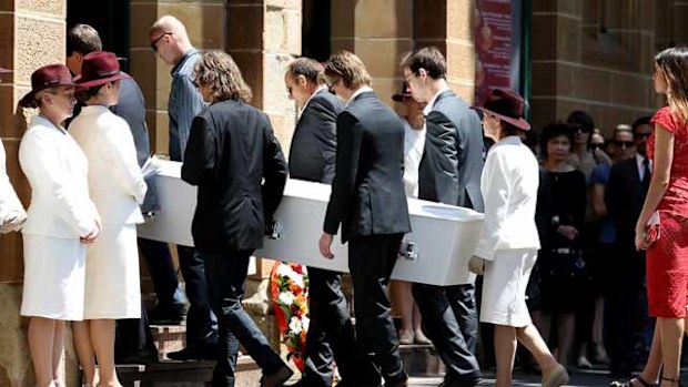 Thomas Zinn and family members carry Tori Johnson's coffin into the memorial service in Sydney. (Nikki Short/AAP)